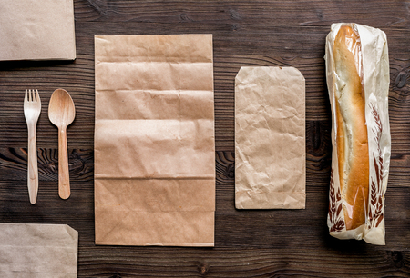 Take away set with paper bags restourant table background top view mockupの写真素材
