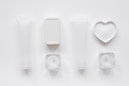 white bottles of body cream and lotion table background top view mock-upの写真素材