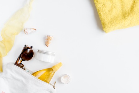 Woman cosmetic set with sun protection lotion white background top view mockupの写真素材