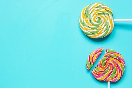 Closeup of candy on blue table background top view mockupの写真素材