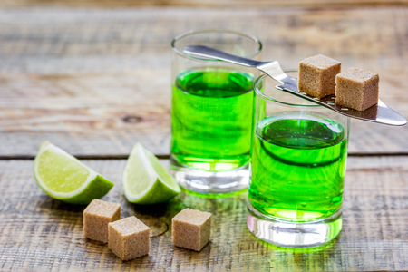 green shots with sugar and lime on table backgroundの写真素材