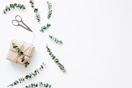 present design in box with flowers on white background top view mockupの写真素材