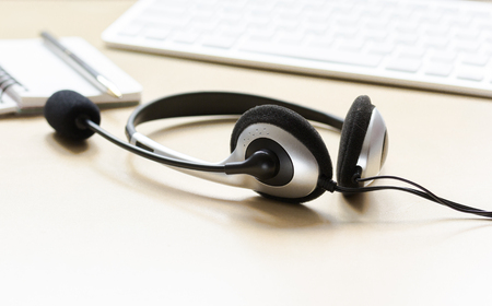 call center manager work desk with headsetの写真素材