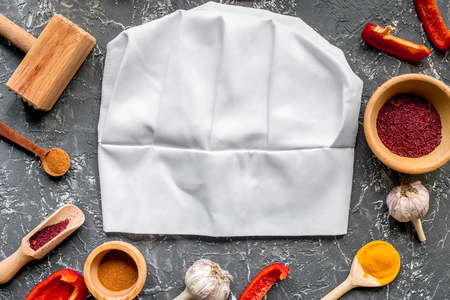 Cook workplace with kitchen tools and sweet pepper gray background top viewの写真素材