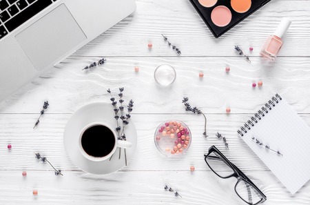 Cosmetics composition with coffee and laptop top viewの写真素材