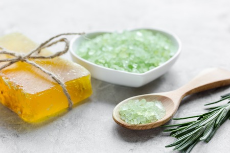 Natural bath salt with rosemary on stone table backgroundの写真素材