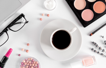 trendy woman desk with decorative cosmetic, coffee and lavender flowers on white background top viewの写真素材