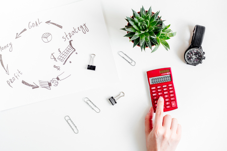 workplace in office with business plan development on white desk background top viewの写真素材