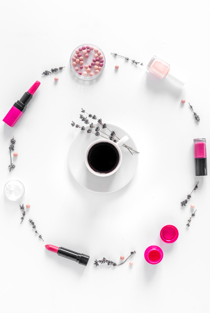 trendy woman desk with cosmetic, lavender, coffee white background top view mockupの写真素材