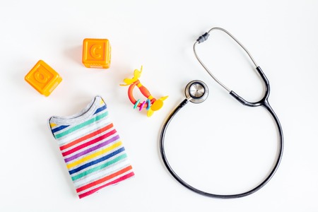 stethoscope, toys on childrens doctor office desk background top viewの写真素材