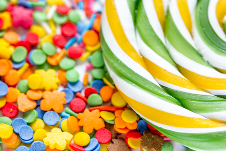 Delicious sugar lollipops on abstract candy background patternの写真素材