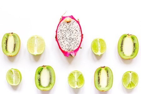 pattern with sliced kiwi and pitaya on white background top view mockup