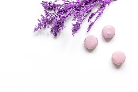 modern spring design in pastel color with macaroons and flowers on white background top view mock upの写真素材