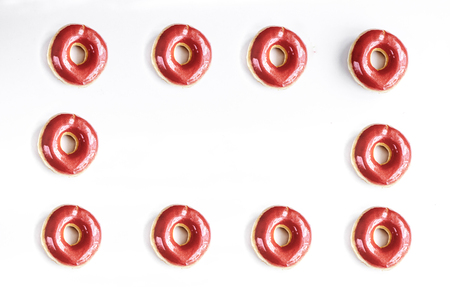 tasty lunch with colorful donuts frame on white table background top view mock upの写真素材