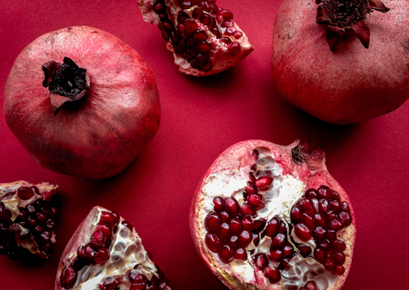 romantic dinner in red color with pomegranate top viewの写真素材