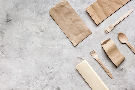 breakfast take away with paper bags on gray table background top view mock upの写真素材