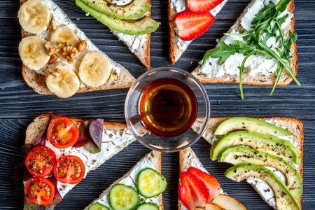 homemade sandwiches composition on white table background top view