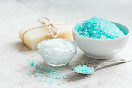 blue sea salt, soap and body cream on stone desk backgroundの写真素材