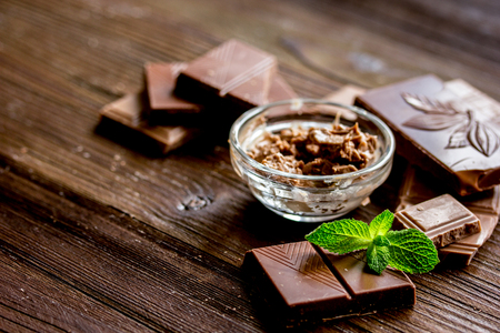 black chocolate design with mint on wooden backgroundの写真素材