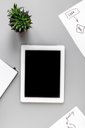 set for business strategy with tablet on gray office table background top view mock upの写真素材