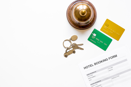 hotel reservation blank and ring on white background top view mockupの写真素材