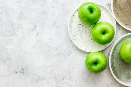 summer food with green apples on stone table background top view mock upの写真素材