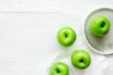 ripe green apples on white table background top view space for textの写真素材