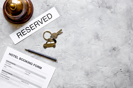 room reservation form on hotel reception desk background top view mock upの写真素材