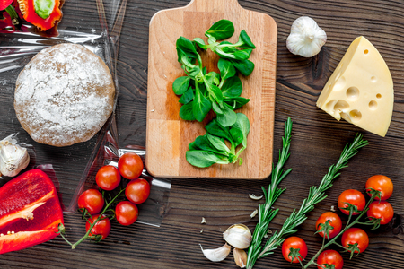 restaurant kitchen with pizza preparing on wooden background top viewの写真素材