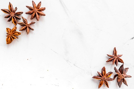 Spices, vanilla and herbs on white kitchen table background top view mock up