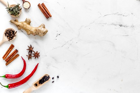 Spices, chili and cinnamon for cooking on white kitchen table background top view mock upの写真素材