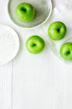 summer food with green apples on white table background top view mock upの写真素材