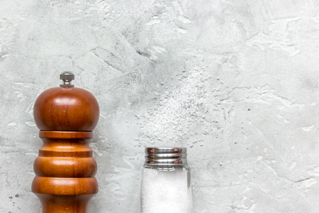 Cooking set with salt and saltcellar on stone background top view mock upの写真素材