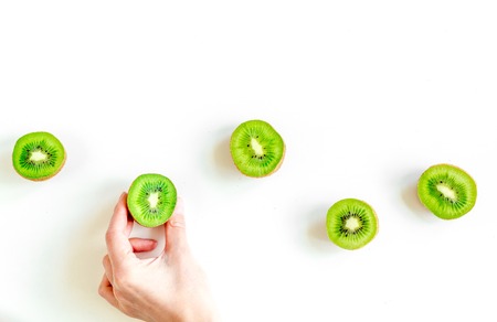 exotic fruit design with green kiwi on white background top view mock upの写真素材