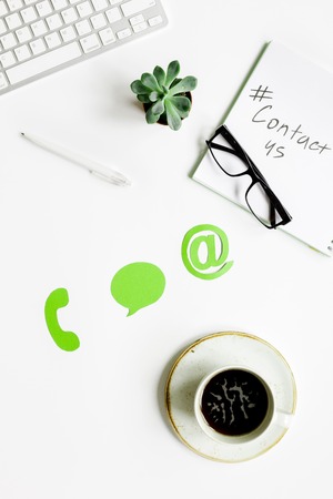 client support service workdesk with contact us mail signs on white background top viewの写真素材