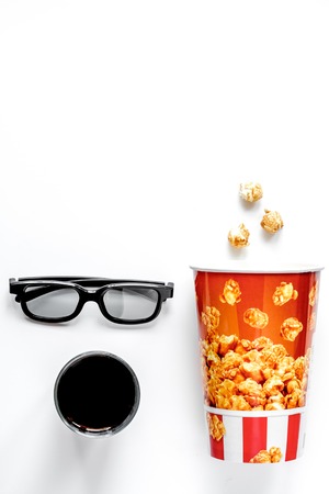 concept of watching movies with popcorn top view on white backgroundの写真素材