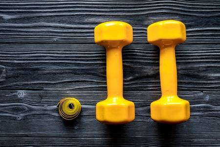 concept preparing to fitness sports equipment top view on wooden backgroundの写真素材