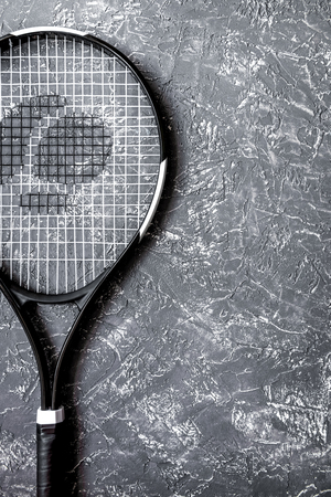 tennis racket on gray background top view.の写真素材