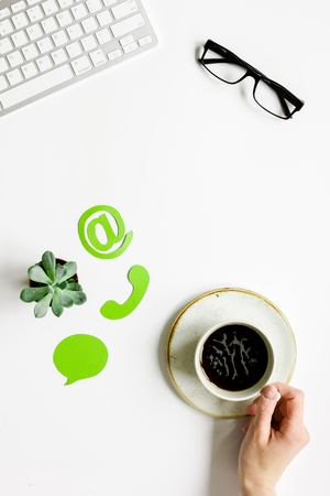 Company feed back concept with coffee and keyboard white background top viewの写真素材
