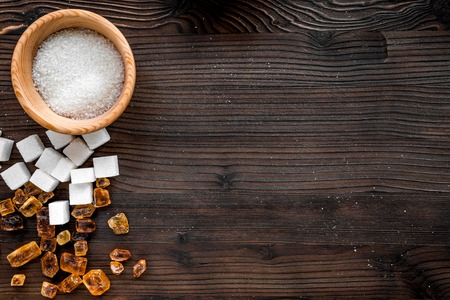 lumps of sugar with bowls sweet set on wooden kitchen table background top view mockupの写真素材