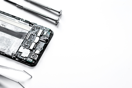 concept repair smartphone - parts of digital gadgets with toolsの写真素材