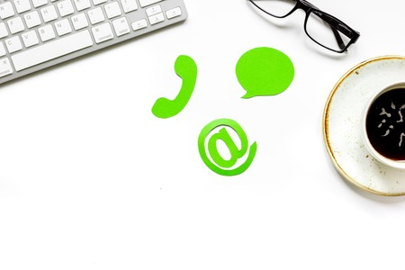 company feed back concept with coffee and keyboard white background top view mockupの写真素材