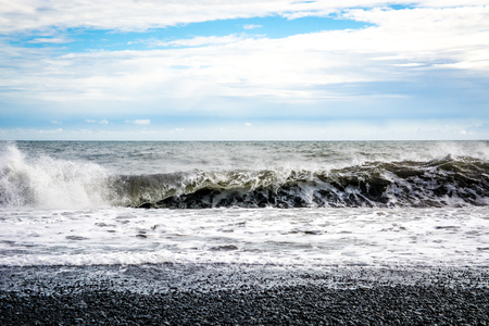 Black sand beach, Reynisfjara shore near the village Vik, atlantic ocean, Icelandの写真素材