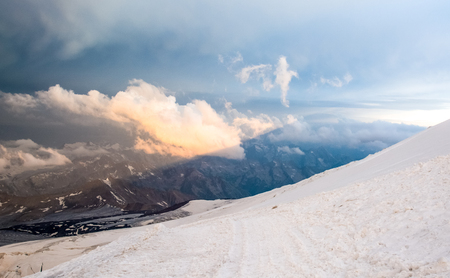 Snow tops of high Mount Elbrus at sunset, mountain landscape, sights and nature.の写真素材