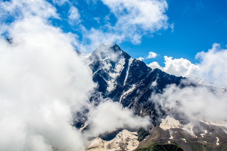 amazing landscape of rocky mountains and blue sky, Caucasus, Russia.
