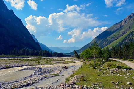 River and waterfall in forest, mountains of Caucasus, Russiaの写真素材