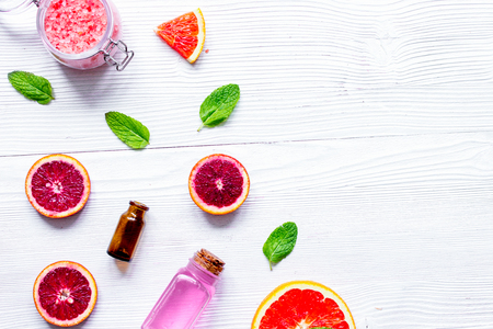 organic cosmetic with citrus on wooden background top view.の写真素材
