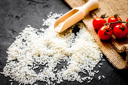 ingredients for paella on dark background close up.の写真素材