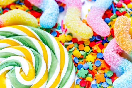colorful sweets and sugar candies on abstract background patternの写真素材