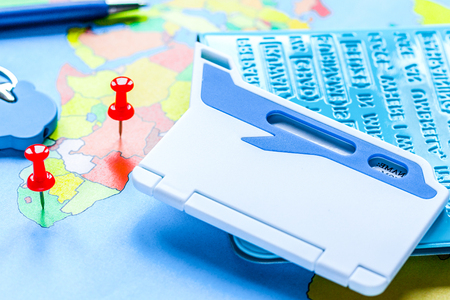 Traveling concept with passport for booking on map backgroundの写真素材